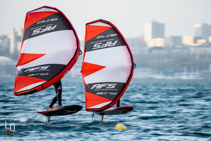 Two people wing foiling using AFS equipment.